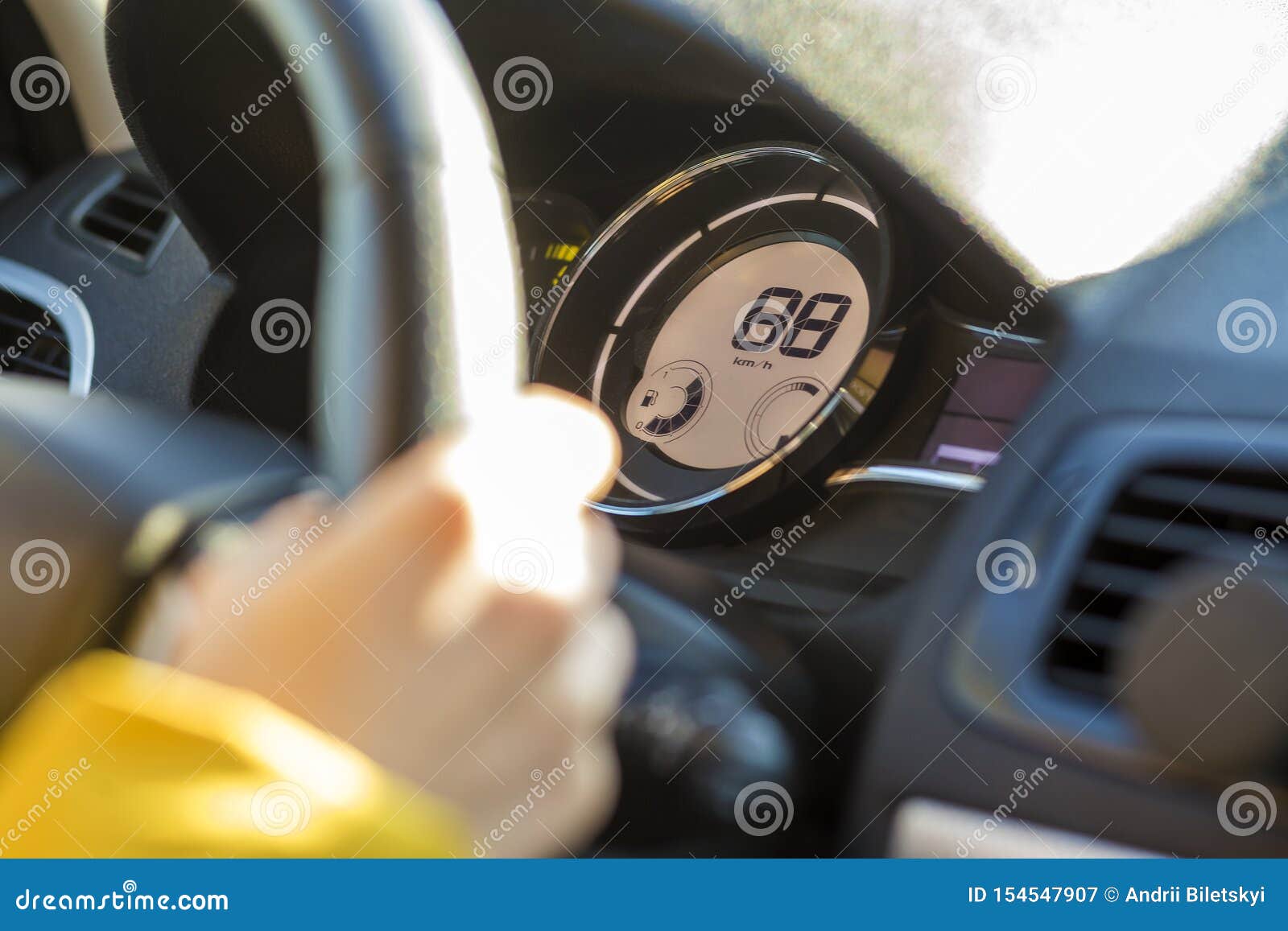 Modern Car Interior with Driver Hand on Steering Wheel. Safe Driving