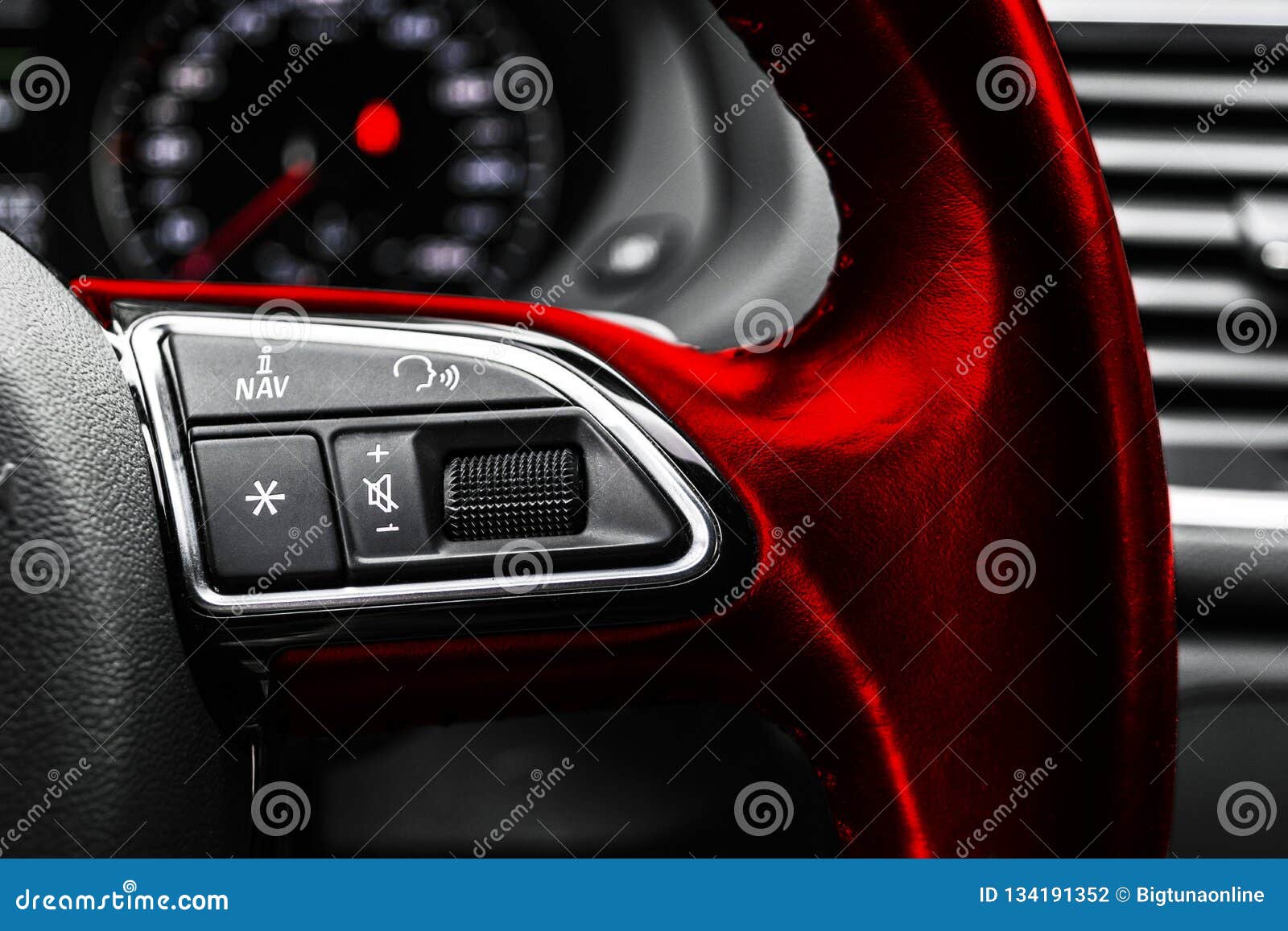 modern car interior. red steering wheel with media phone control buttons, navigation multimedia system background. car interior de