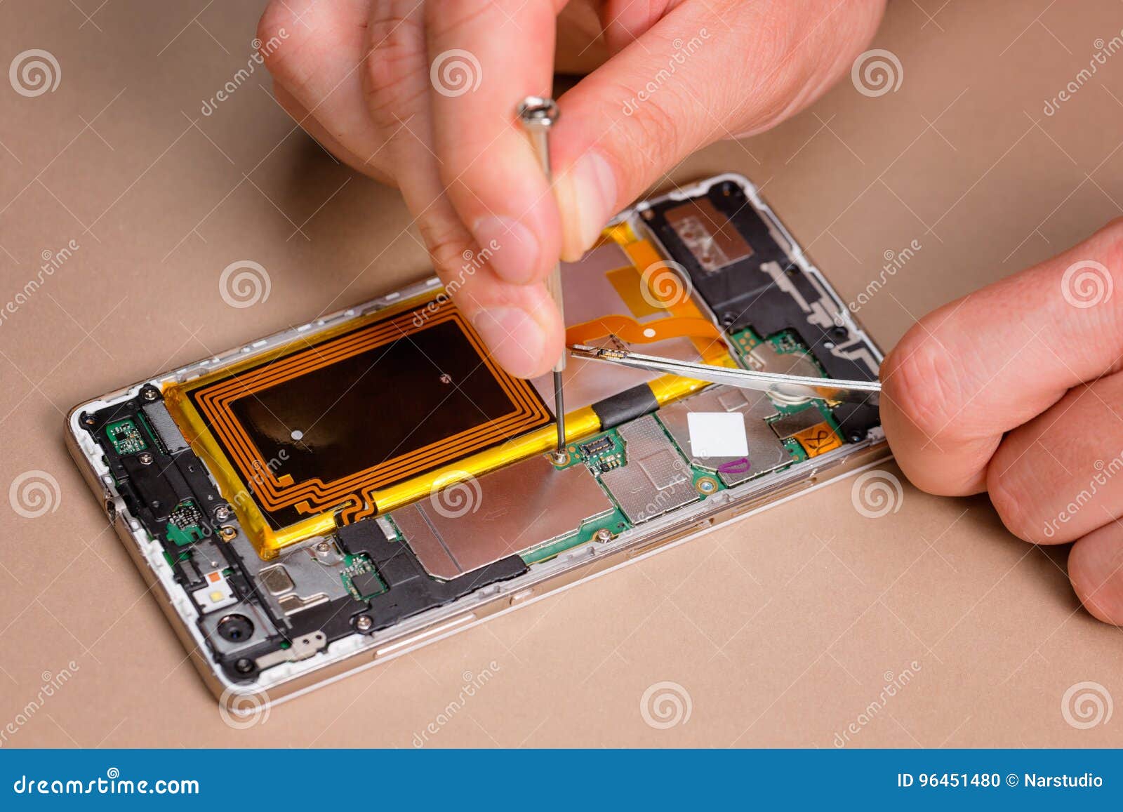 Modern Cellphone Assembly with Hands Visible. Stock Photo Image of