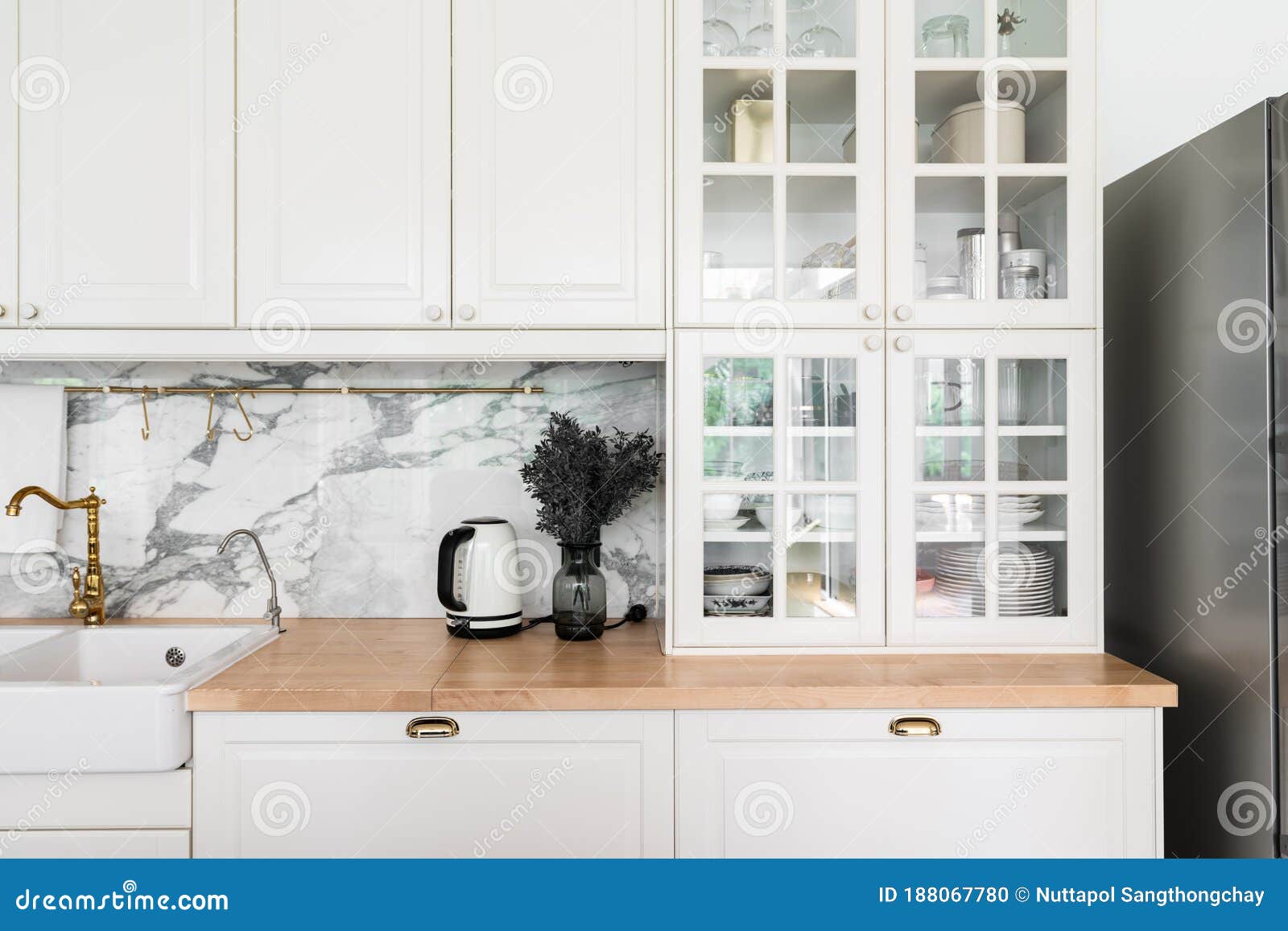 Modern Classic Kitchen Interior With Kitchen Appliances And White Ceramic Sink With Gold Mirror Faucet On Wood Top With Marble Stock Photo Image Of Board Cutting 188067780