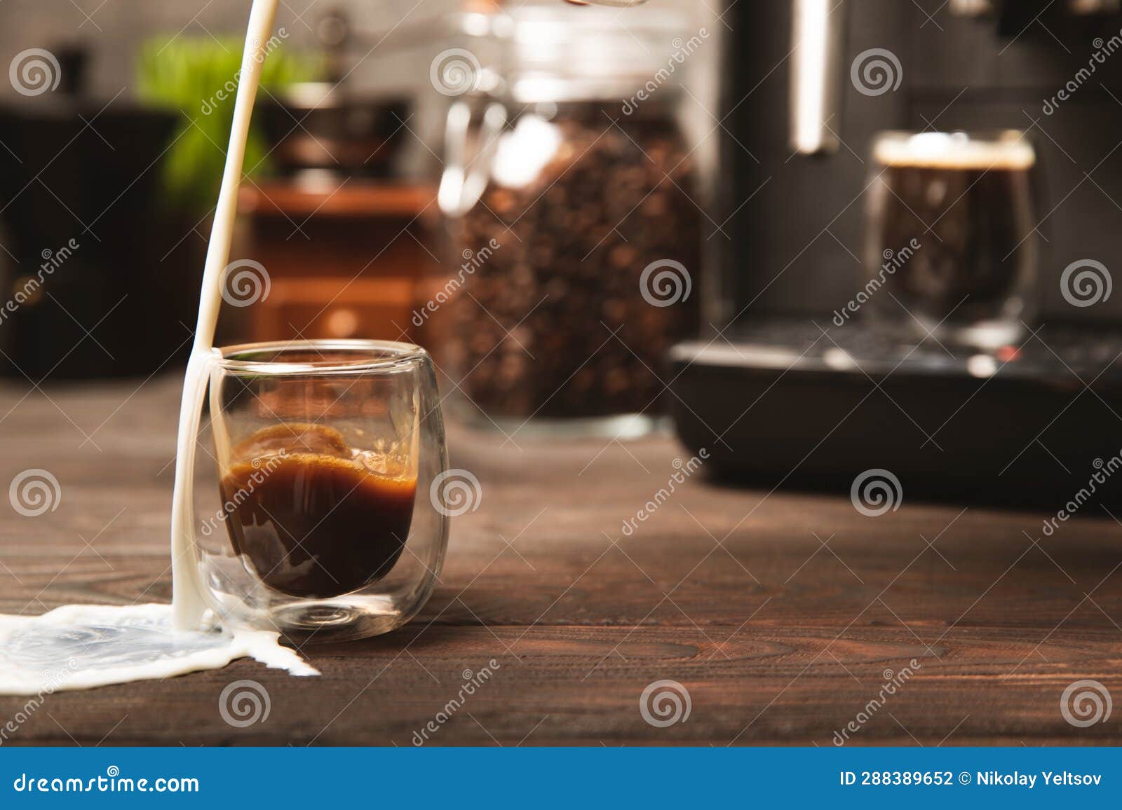 Modern Coffee Machine with a Cup on the Kitchen Table. Stock