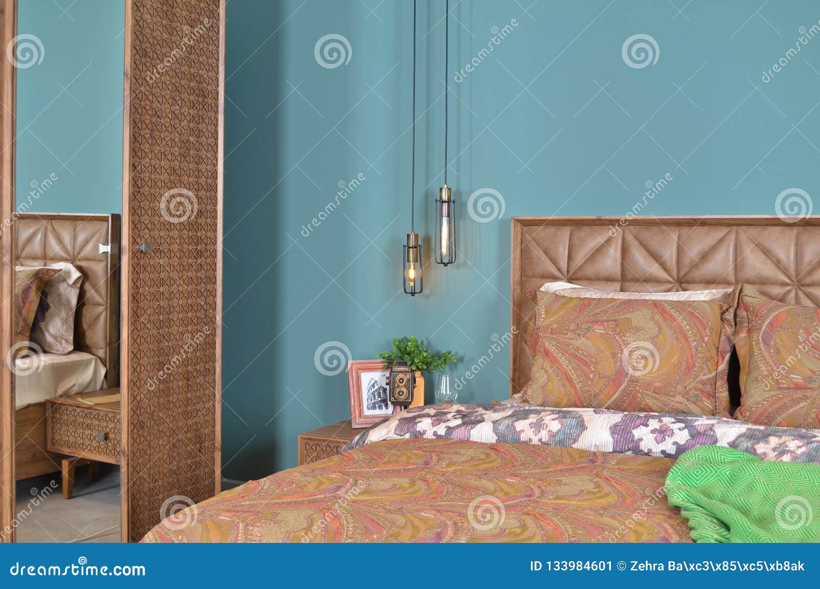 In A Modern Bedroom Bed Pillows And Bedside Lamps Stock Image