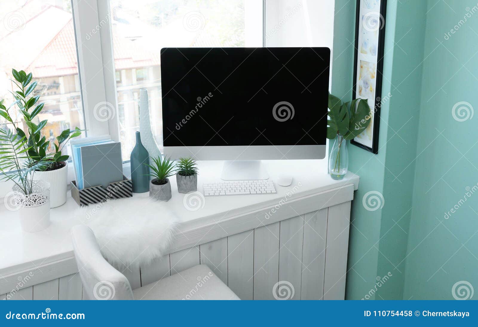 Modern Comfortable Workplace With Computer On Window Sill