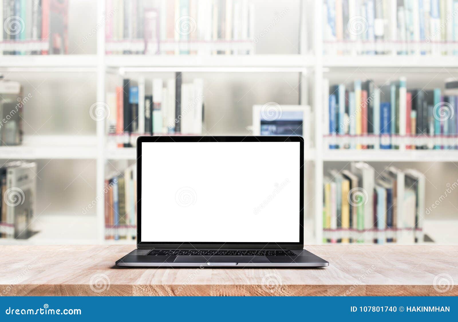 modern computer,laptop with blank screen on blur library