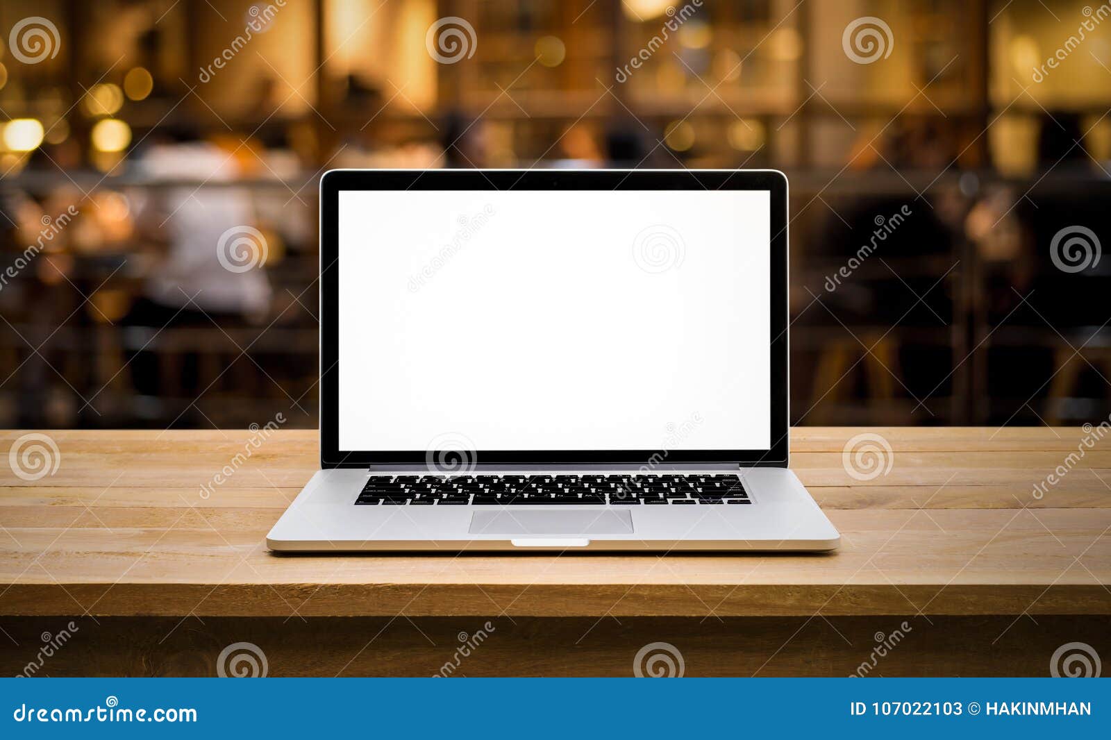 modern computer,laptop with blank screen on table with blur cafe