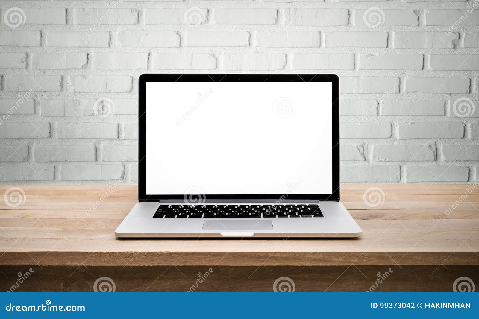 Modern Computer,laptop with Blank Screen on Wall Brick Stock Photo
