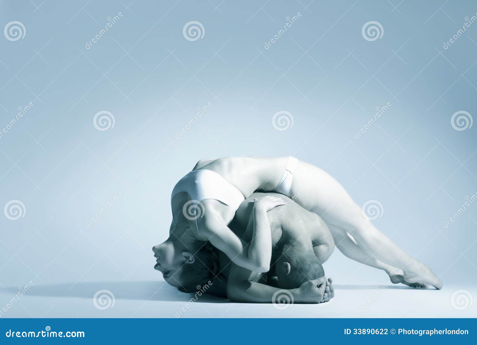 modern dance couple performing over blue background