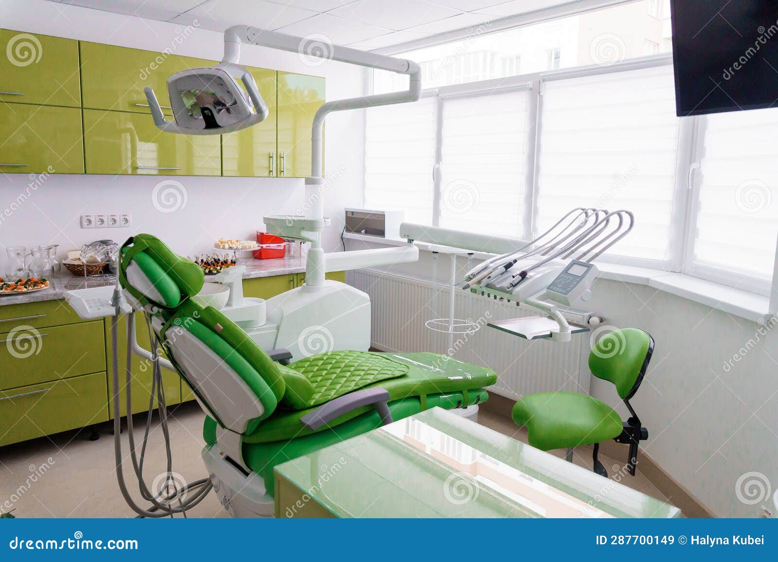 Modern Dental Office in Green. Dental Unit with Dental Instruments