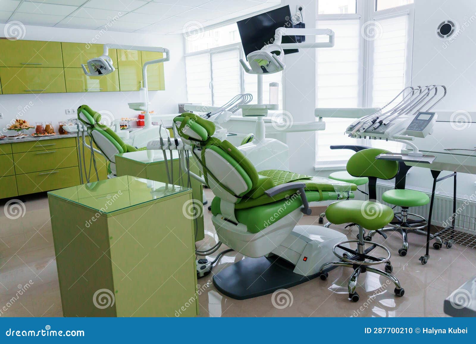 Modern Dental Office in Green. Dental Unit with Dental Instruments