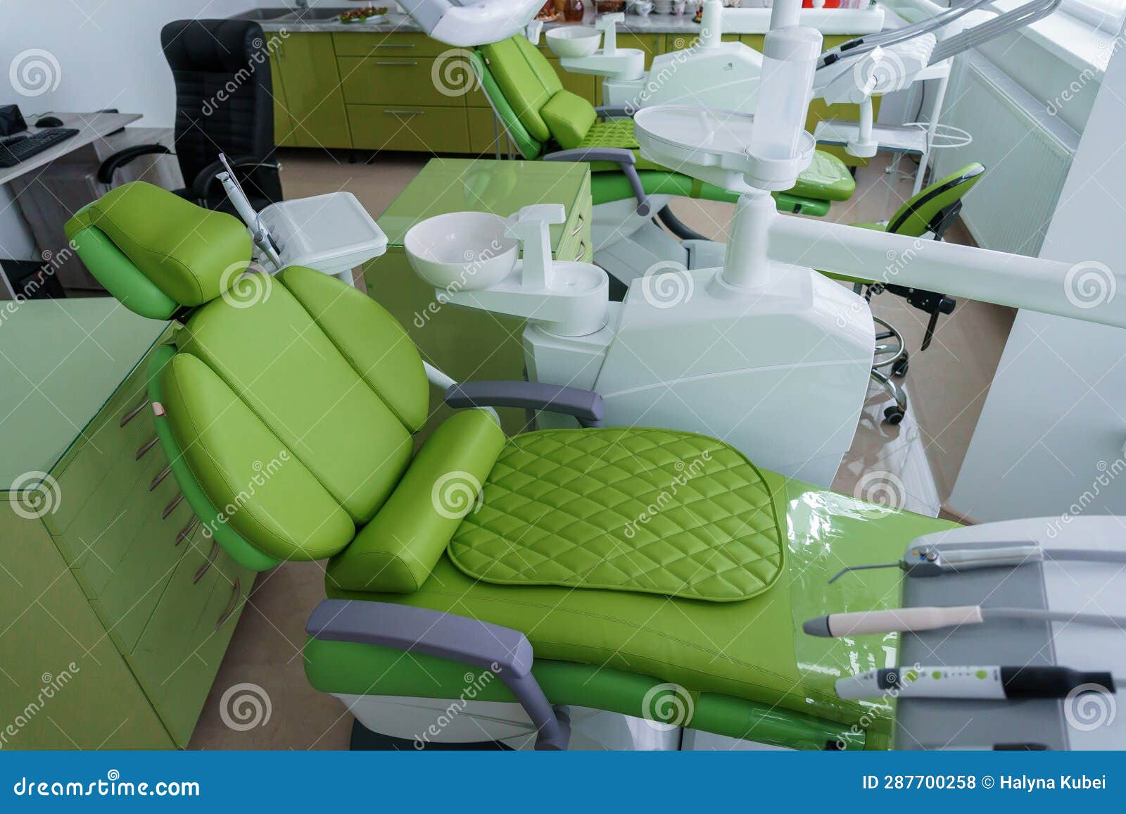Modern Dental Office in Green. Dental Unit with Dental Instruments