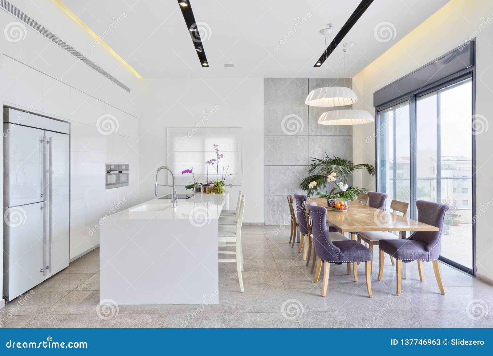 Design of Luxury Kitchen with Marble Island and Dinner Table Stock