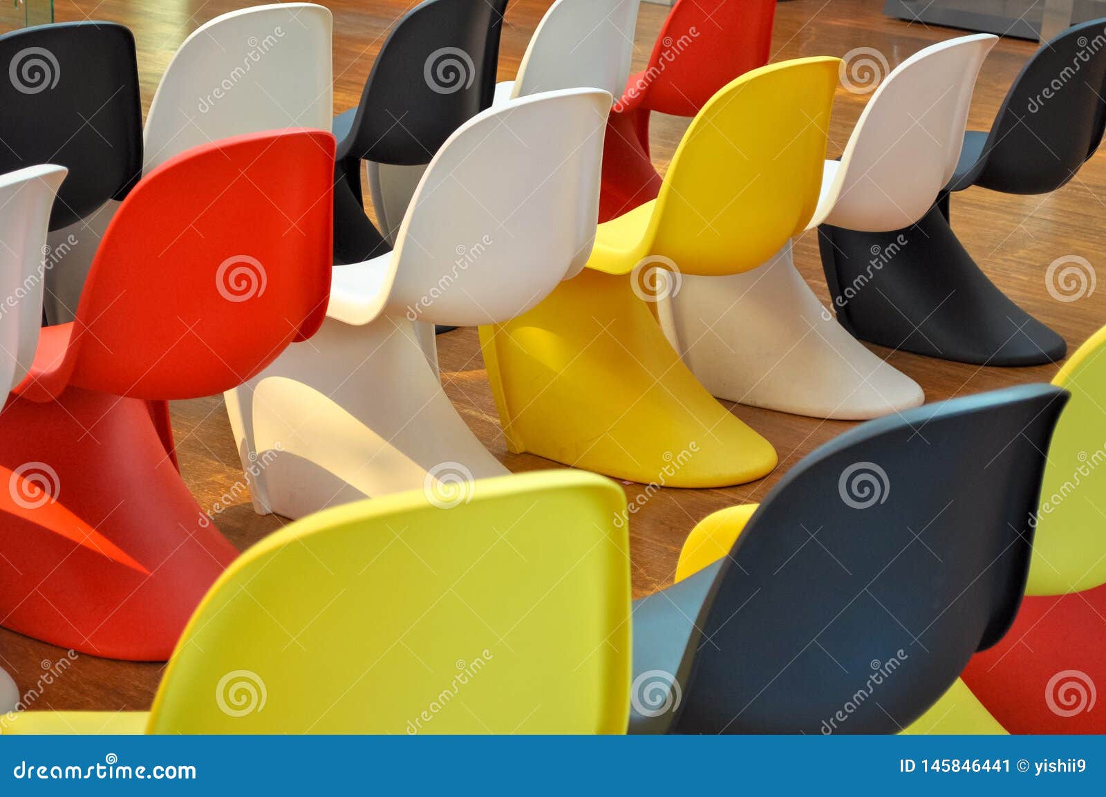Colorful Plastic Chairs Lined Up in a Room Stock Image Image of
