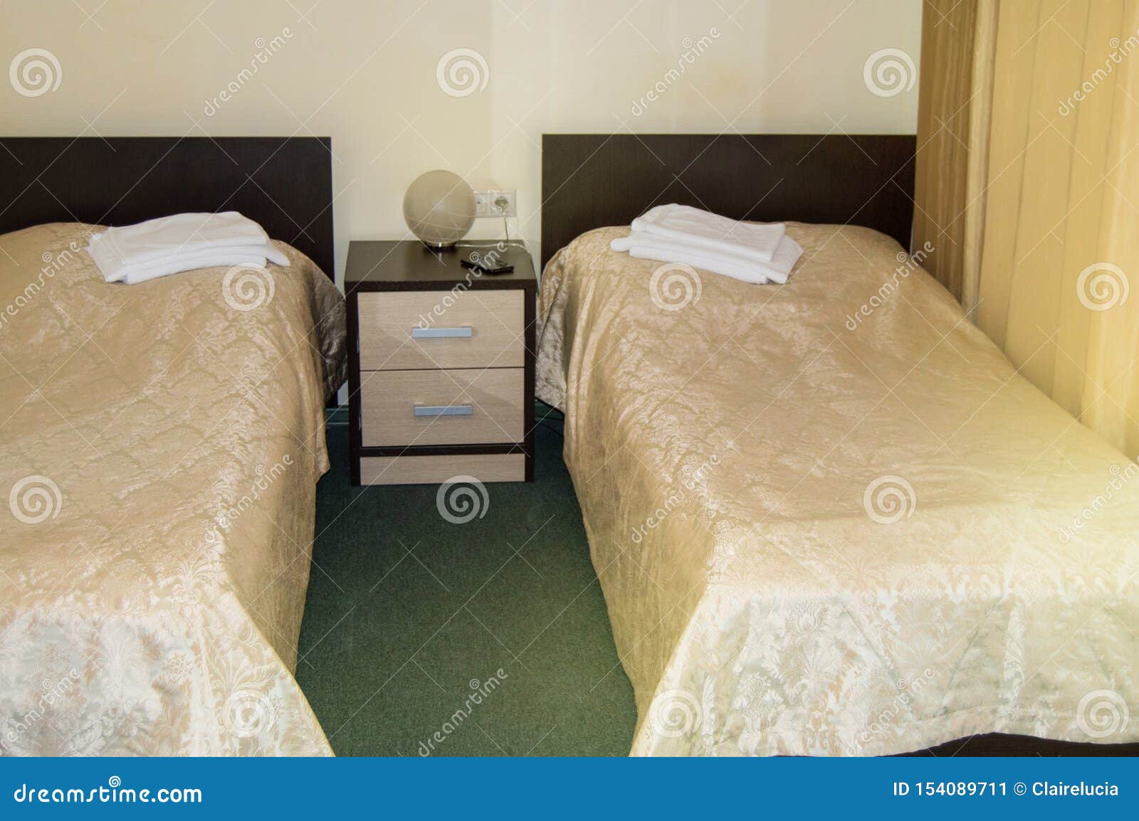Modern Double Room With Two Single Beds Bedside Table Towels And