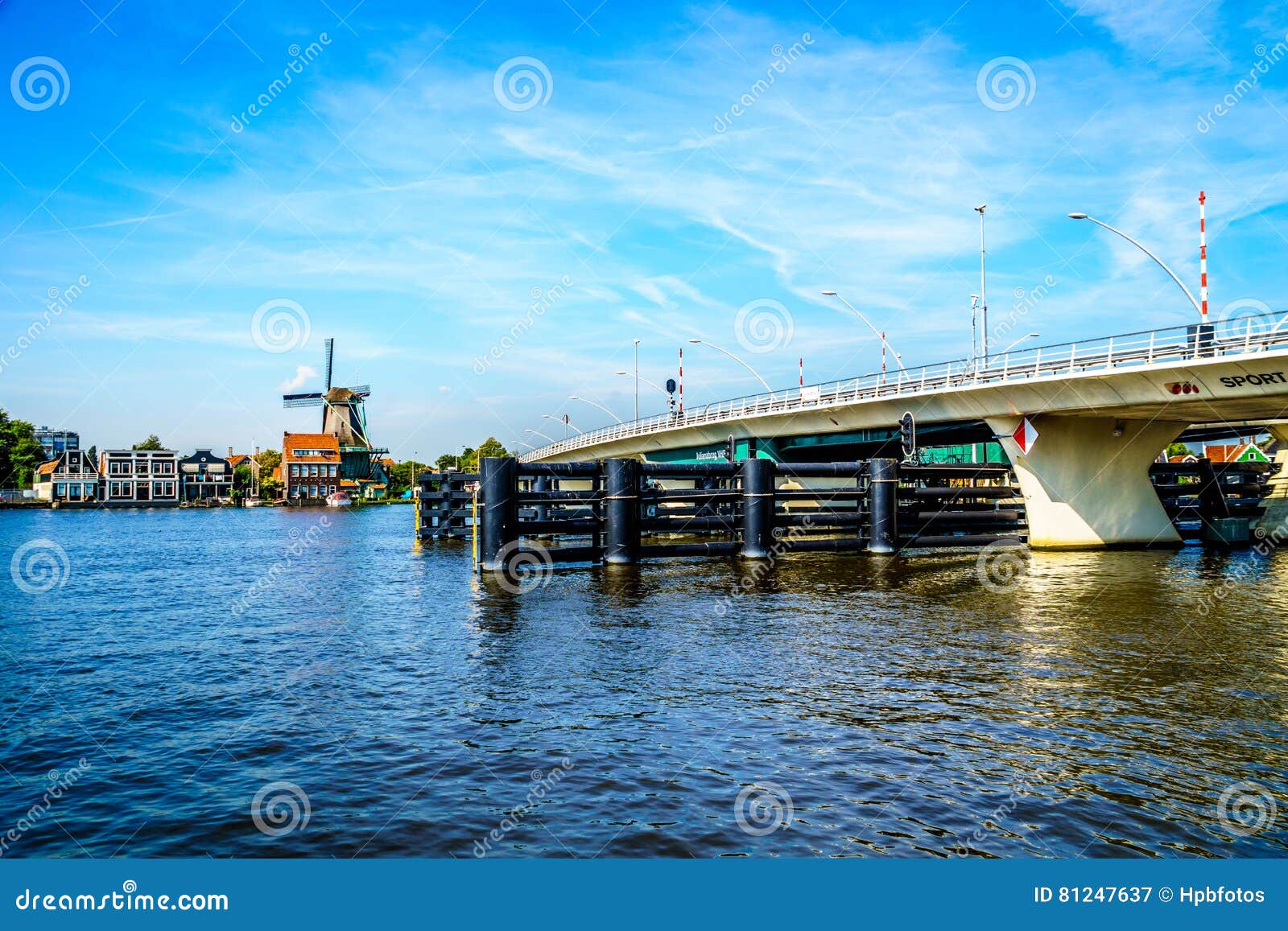 modern draw bridge at the town of zaandijk crossing the zaan river