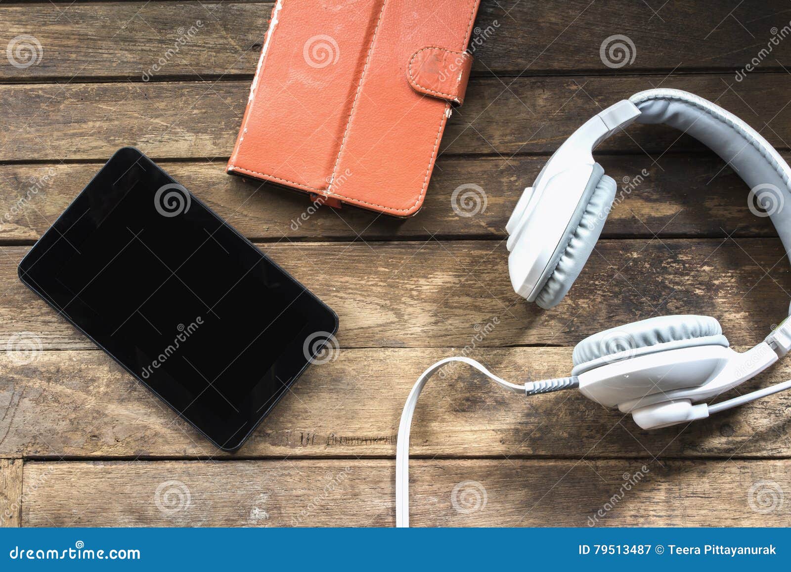 Modern Electronic Communication Tools on a Wooden Floor Stock Image