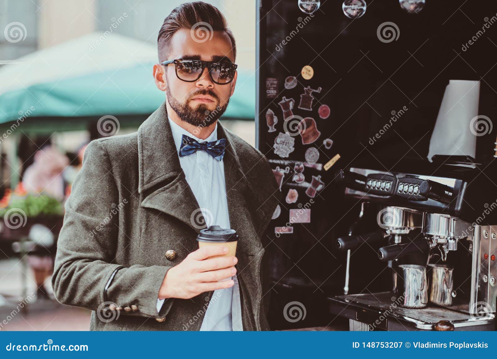 Modern Elegant Man in Sunglasses is Drinking Coffee while Sitting ...