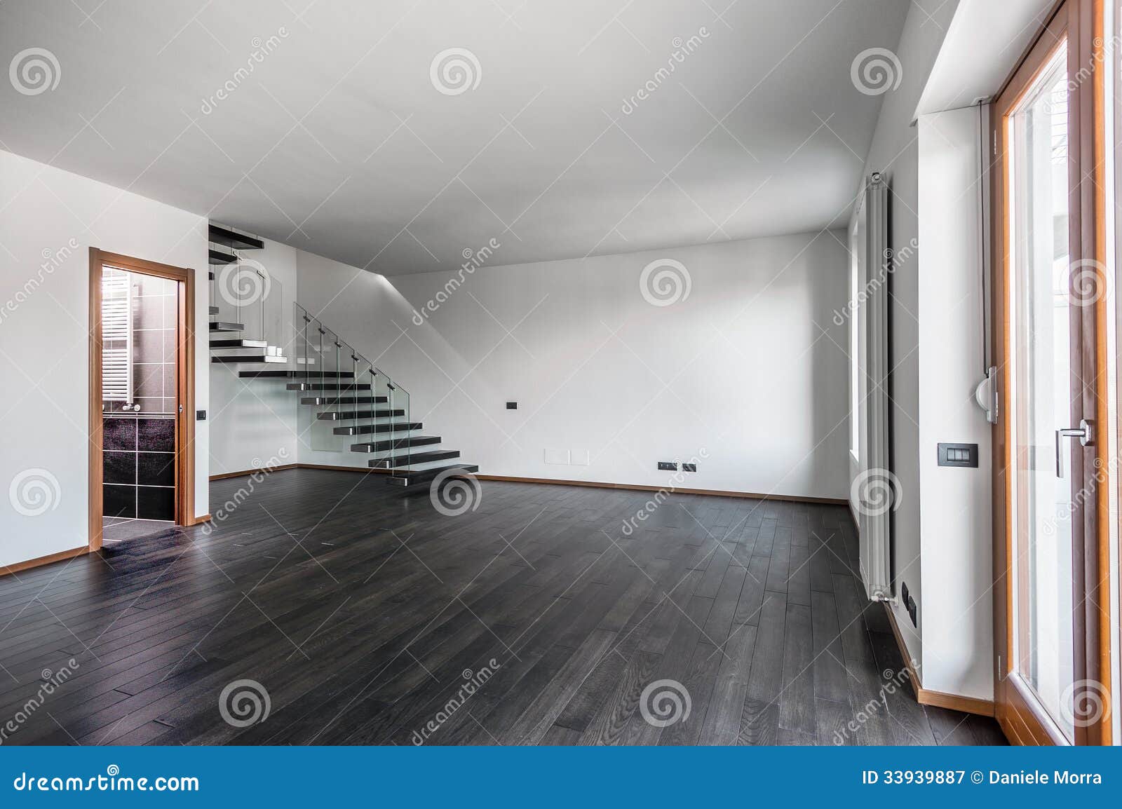 modern empty interior with dark parquet and staircase