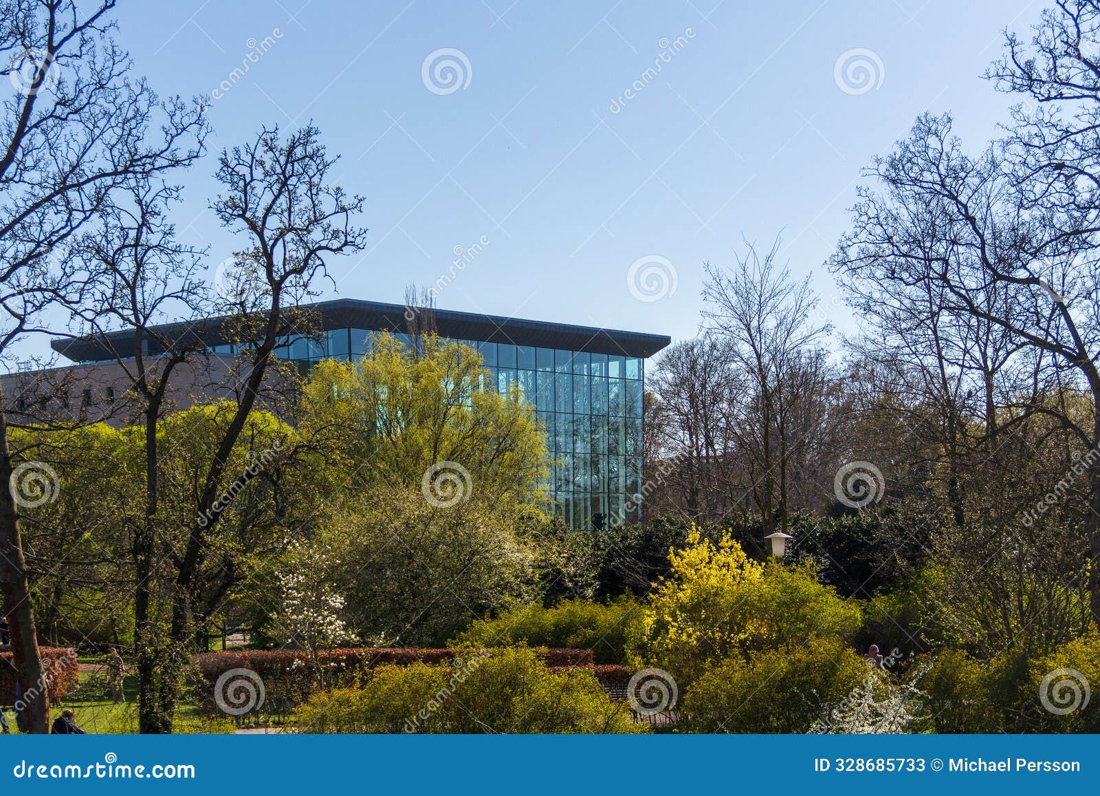 modern glass facade of city library in park in malmÃ¶ sweden