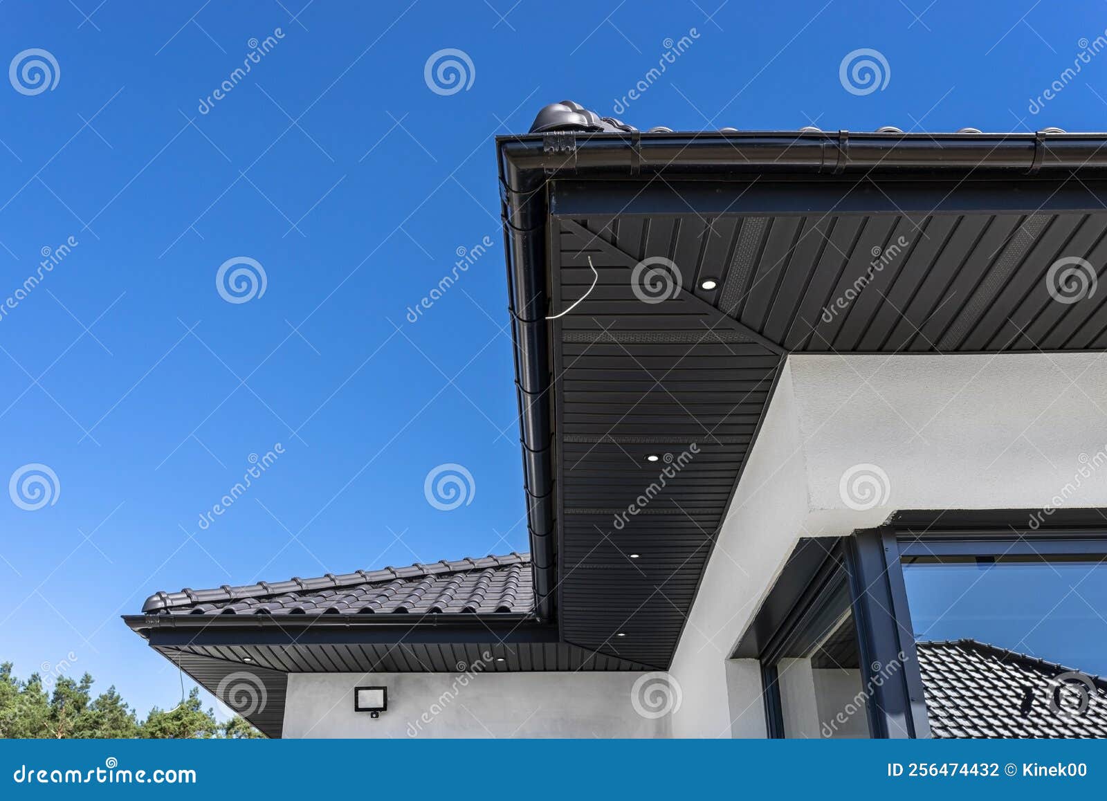 A Modern Graphite Herringbone Roof Lining is Attached To the Trusses