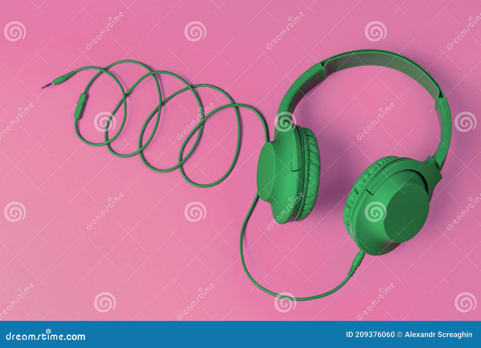 Modern Green Headphone on Pink Background. Music Concept. Stock Photo