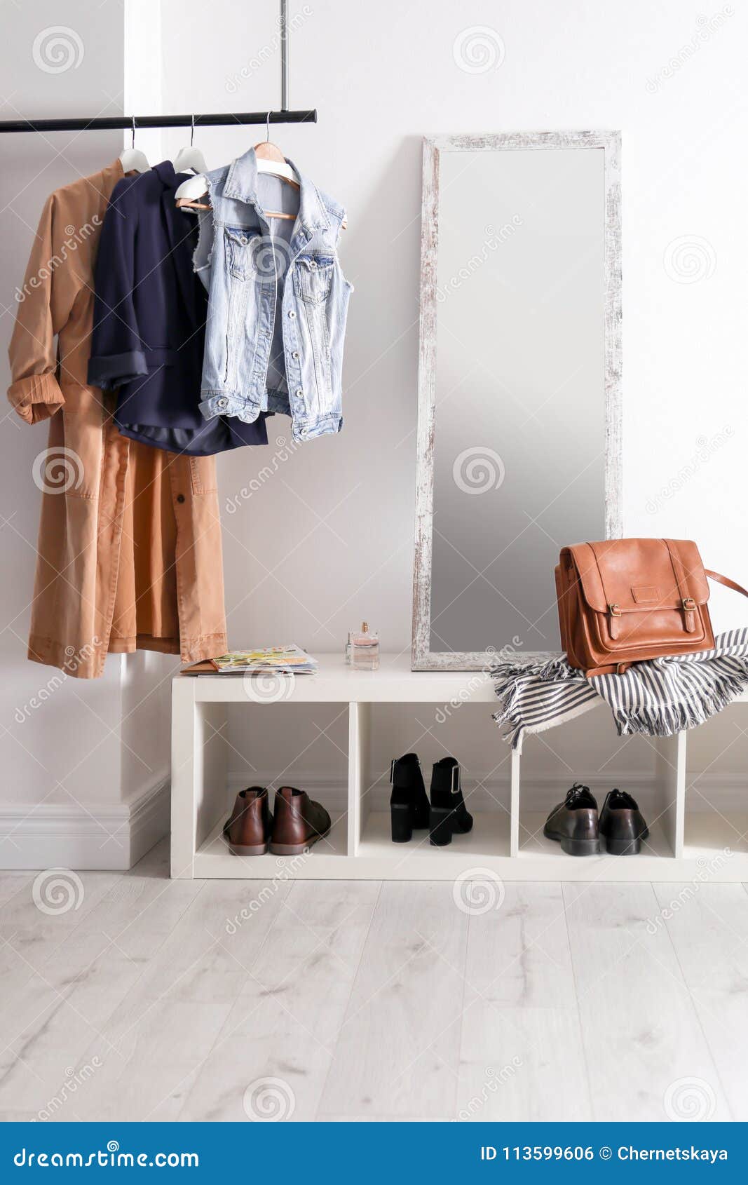Modern Hallway Interior With Hanging Clothes Stock Photo