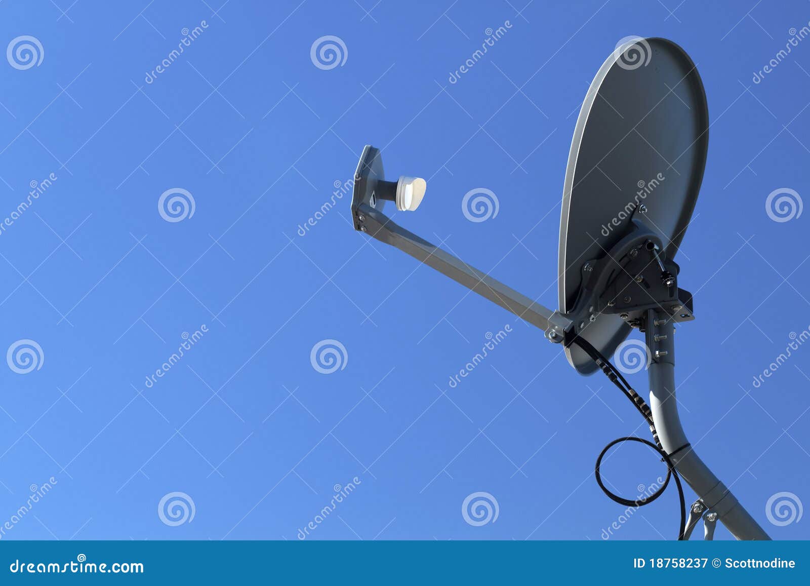 modern hd satellite dish on a clear blue sky day