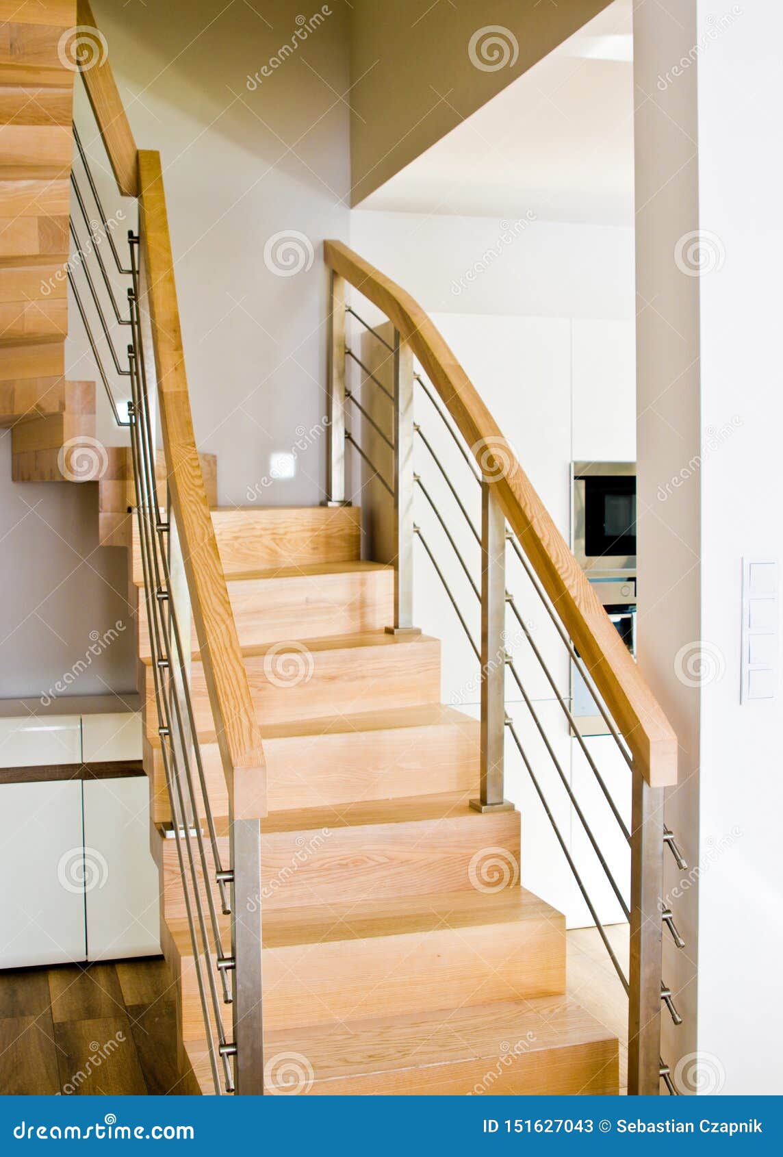 modern home living room area with wooden stairs