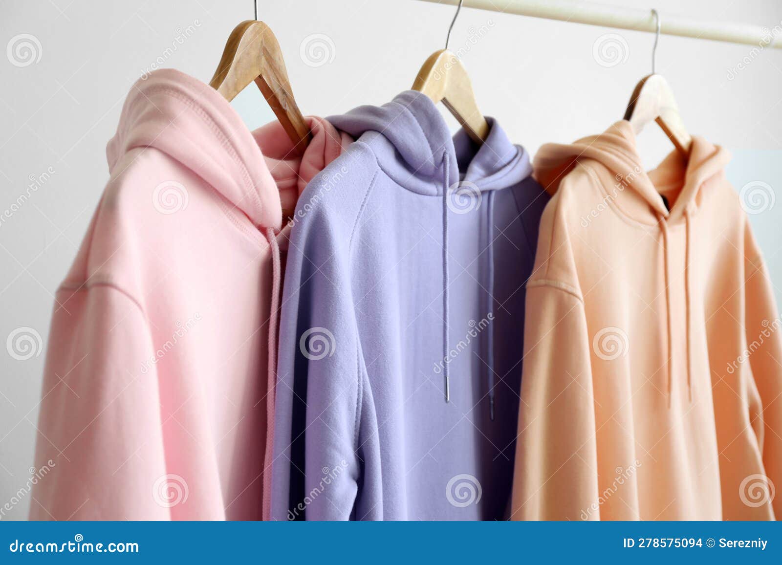Modern Hoodies Hanging on Light Wall Stock Photo Image of design