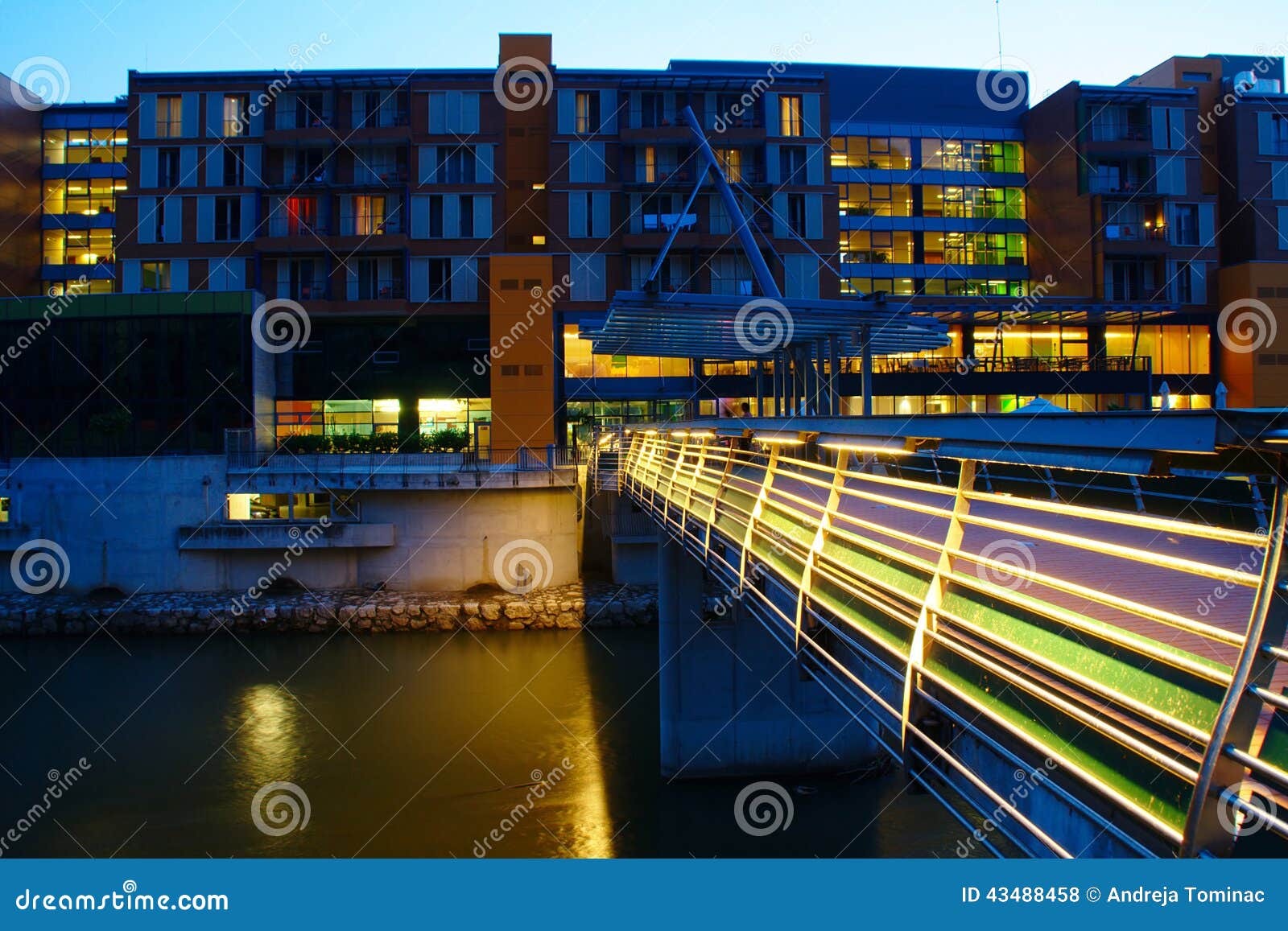 modern hotel by the river by night