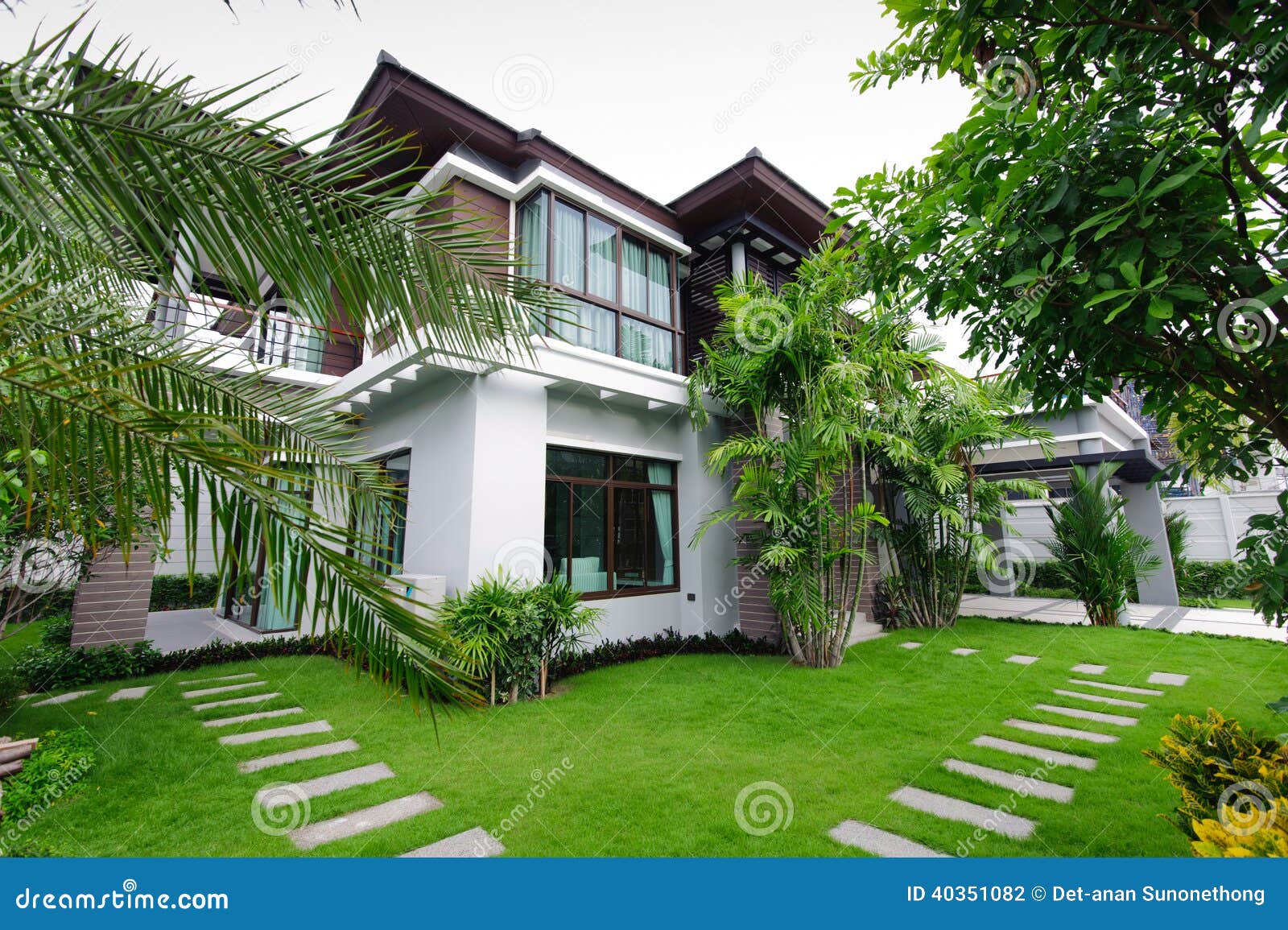 Modern house in the garden stock photo. Image of housing 40351082