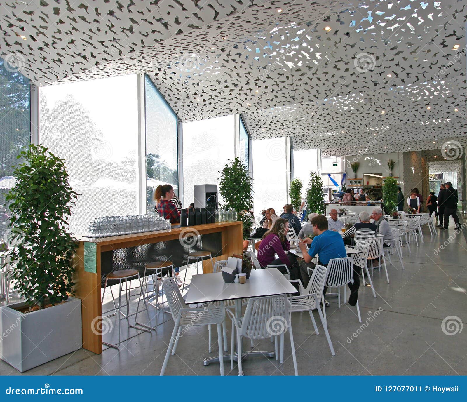 Modern Indoor Cafe Ilex Seating Area With People At Christchurch