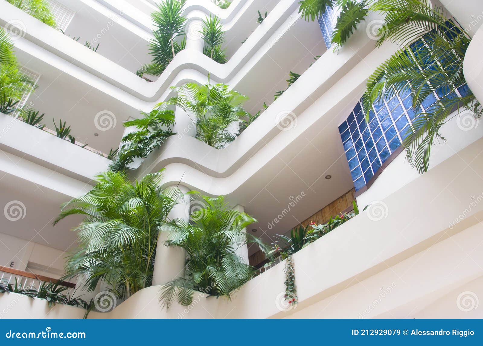 modern interior building with luxuriant green plants