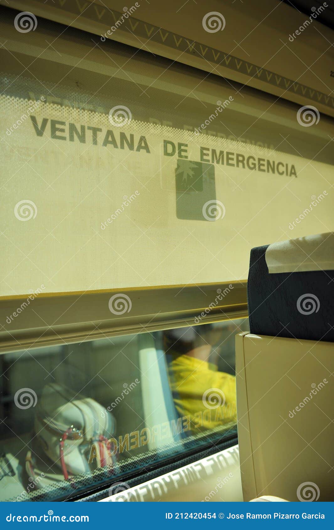 modern interior of a spanish passenger train ave. emergency window