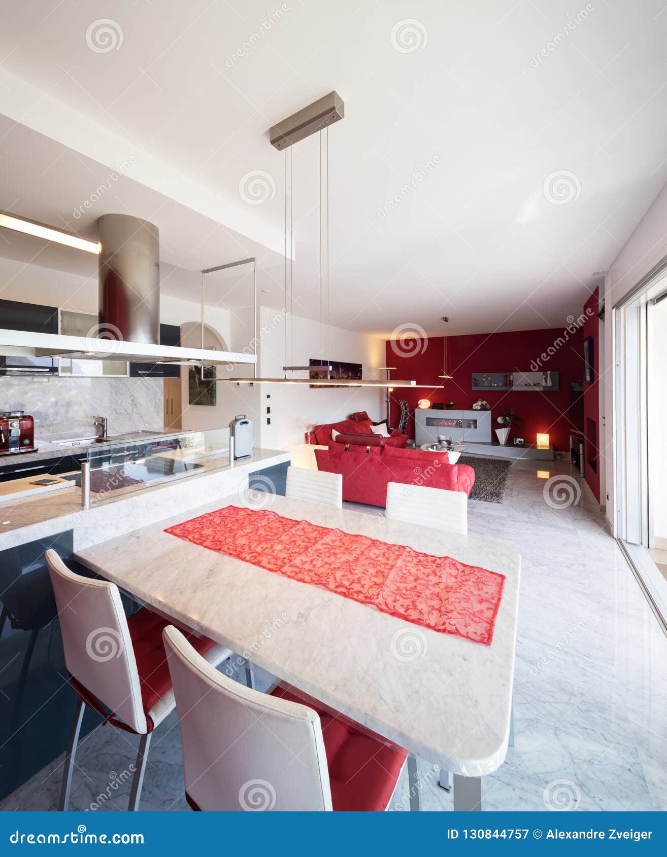 Modern Kitchen with Island, Marble Table and Leather Chairs Stock Image