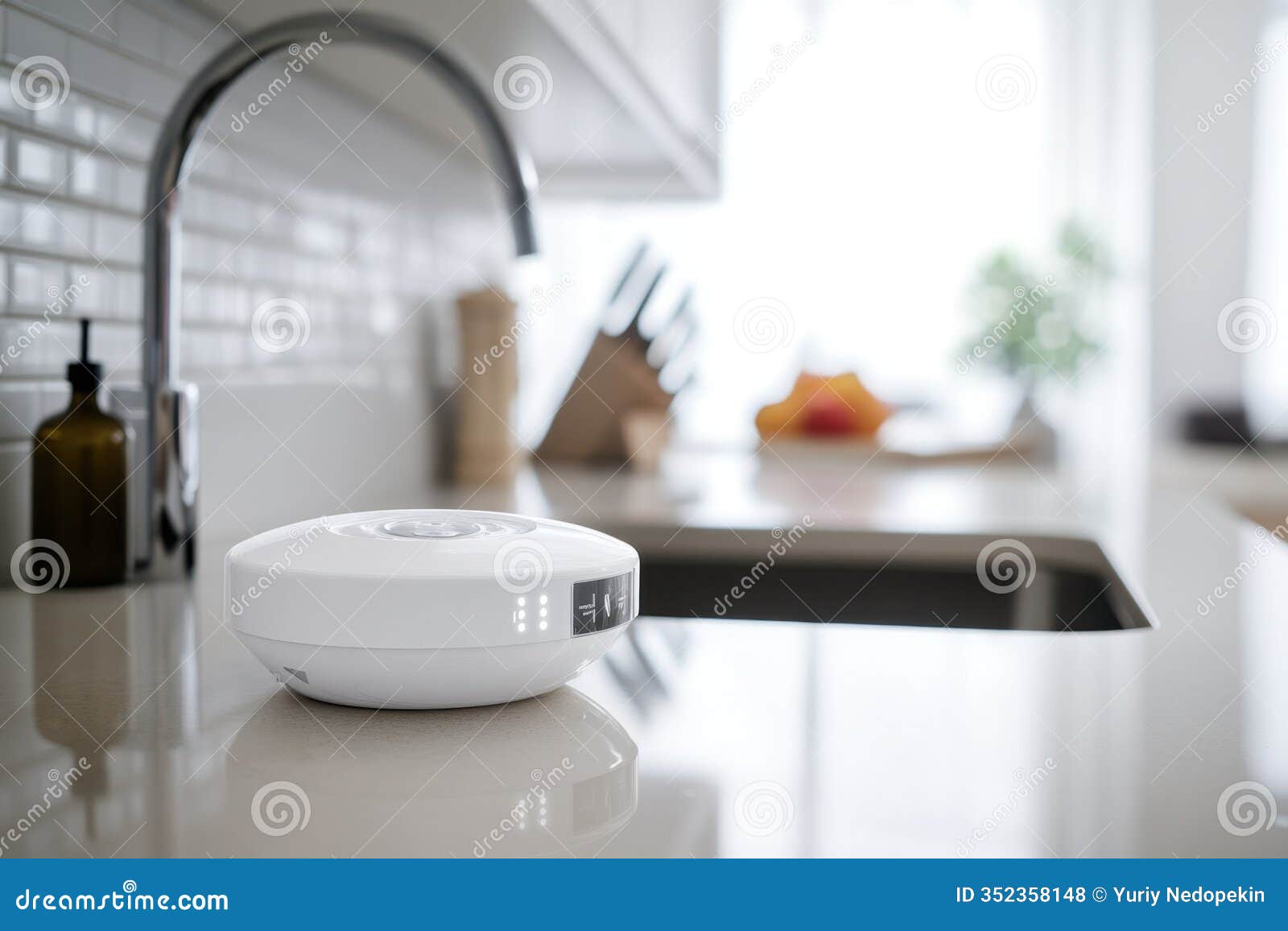 modern kitchen with a stylish white appliance on a counter near a sleek sink and knife set