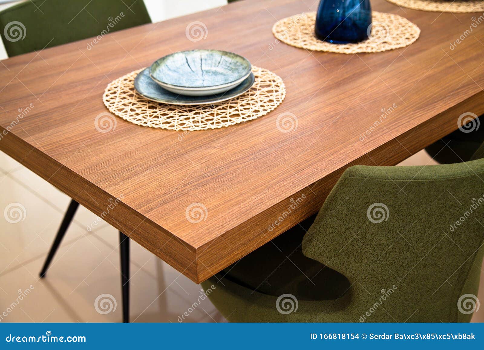 Modern Kitchen, Wooden Walnut Dining Table and Green Chairs Stock Photo