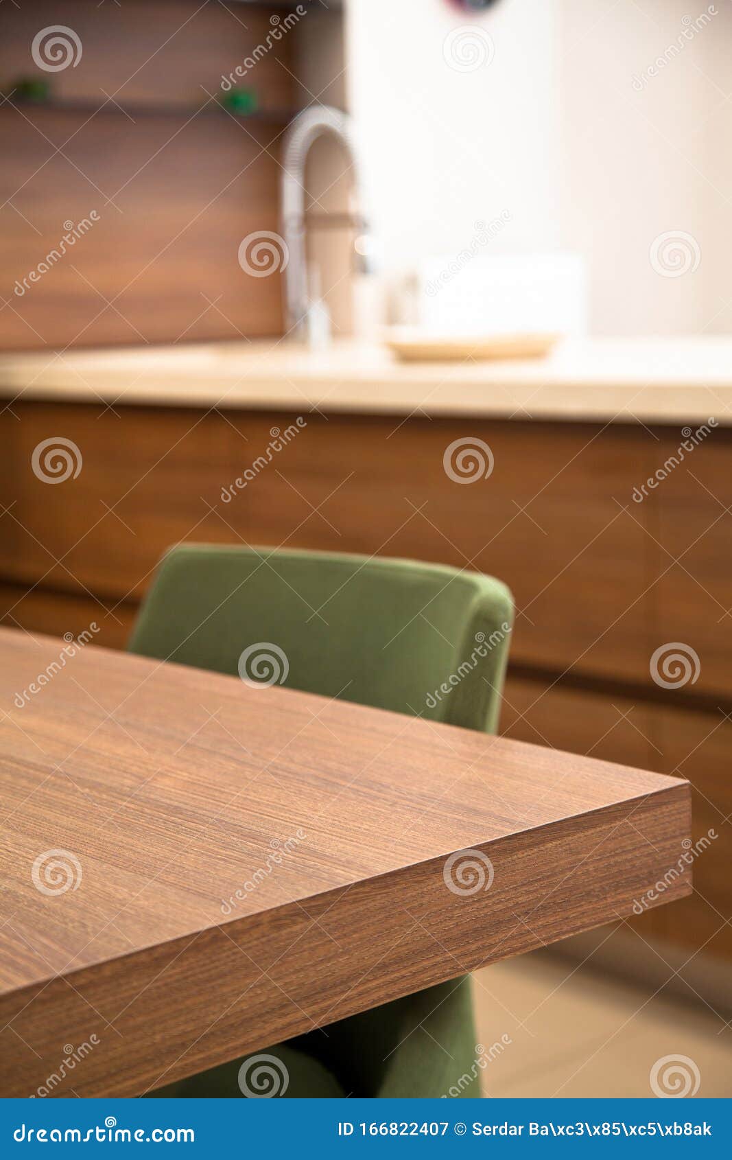 Modern Kitchen, Wooden Walnut Dining Table and Green Chairs Stock Image