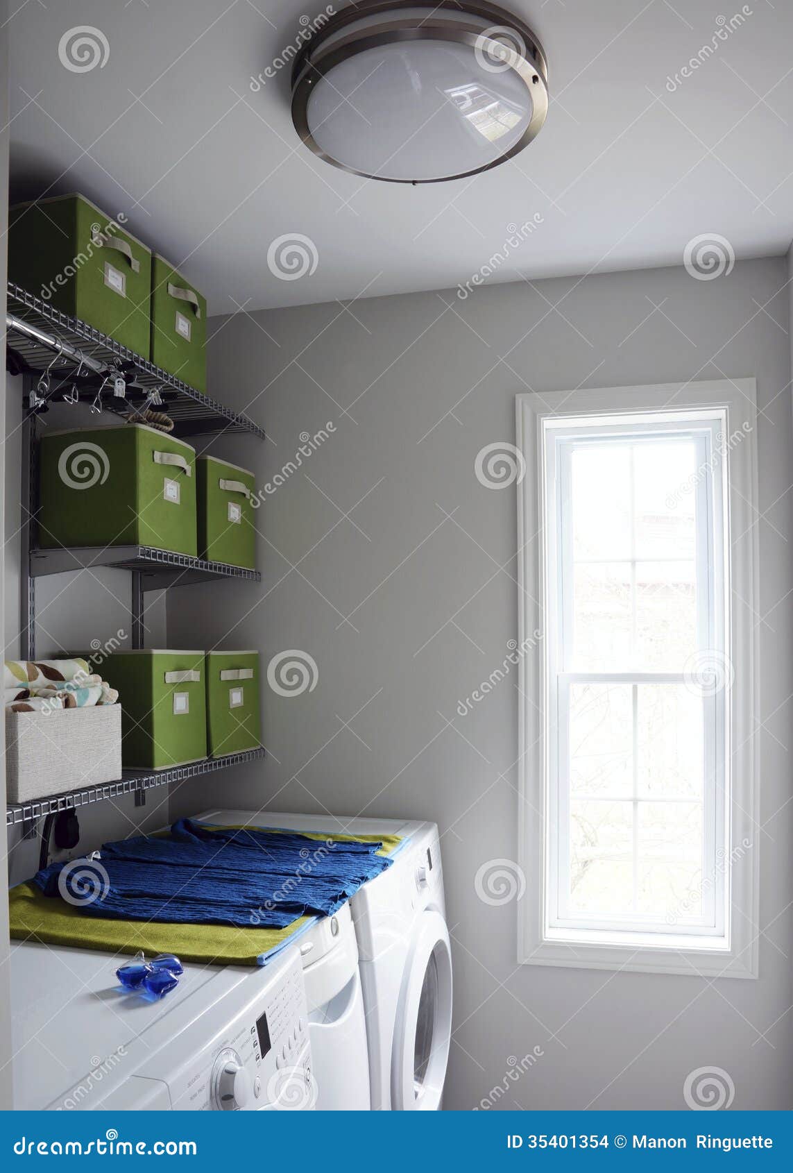 Shelves and brightly-coloured storage containers help to keep a small
