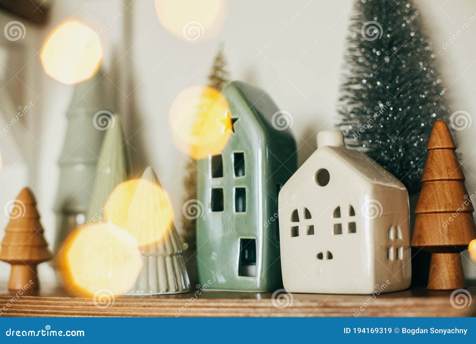 Modern Little Christmas Ceramic House and Glitter Trees on Wooden Shelf ...