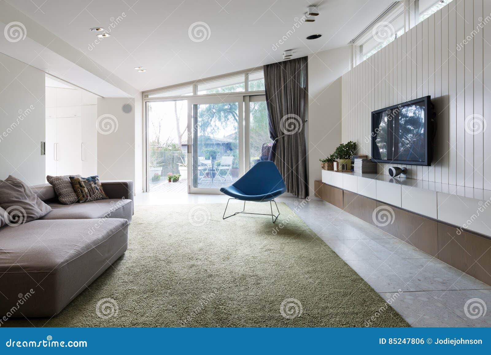 Modern Living Room with Blutterfly Angled Roofline and Wall Hung Stock