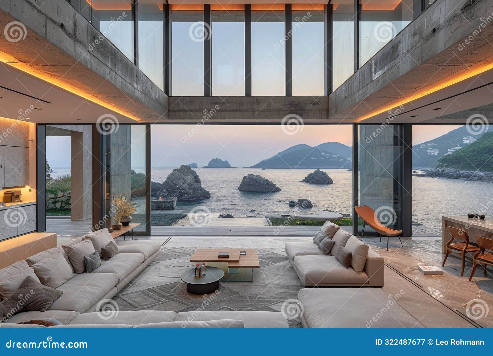 modern living room with floor to ceiling windows and a panoramic ocean view creating a serene and luxurious space