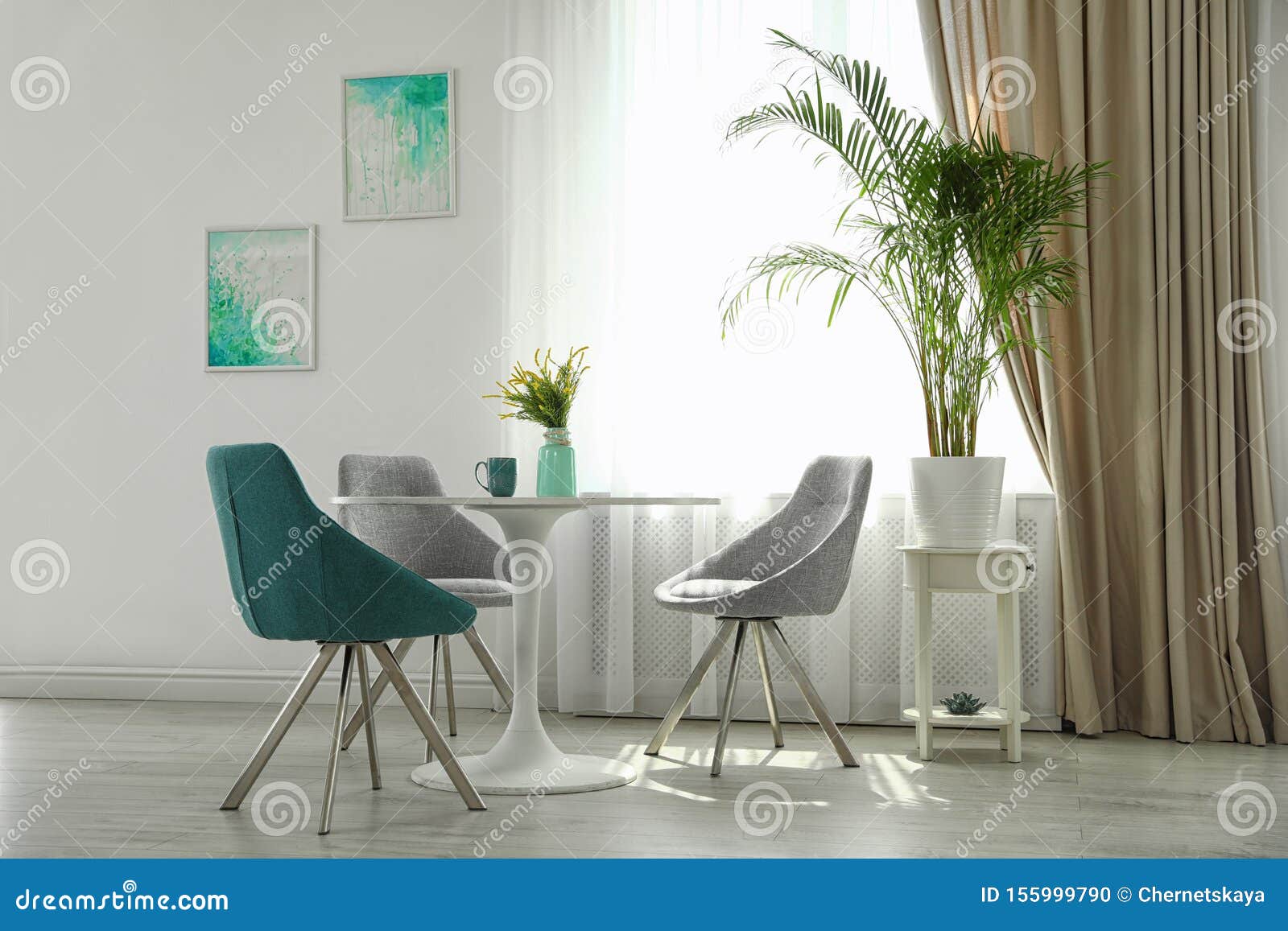 Modern Living Room Interior with Round Table and Chairs Stock Photo
