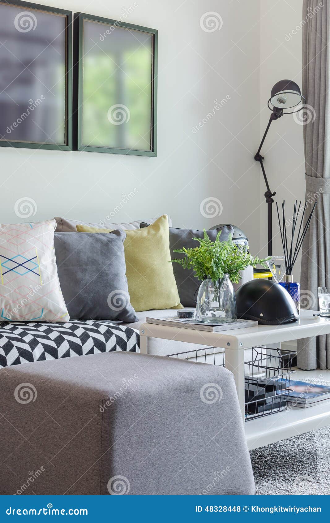 Modern Living Room with Row of Pillow on Sofa at Home Stock Photo