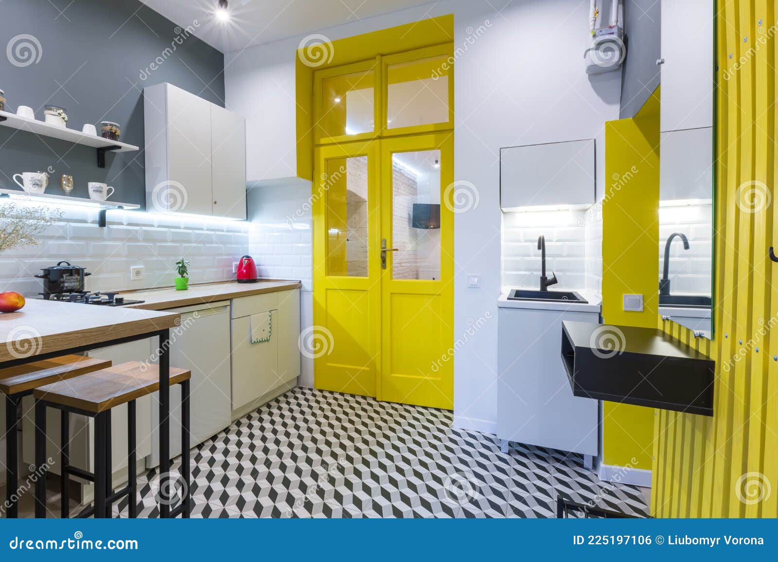 Modern Loft Style Kitchen with Yellow Interior Doors Stock Photo