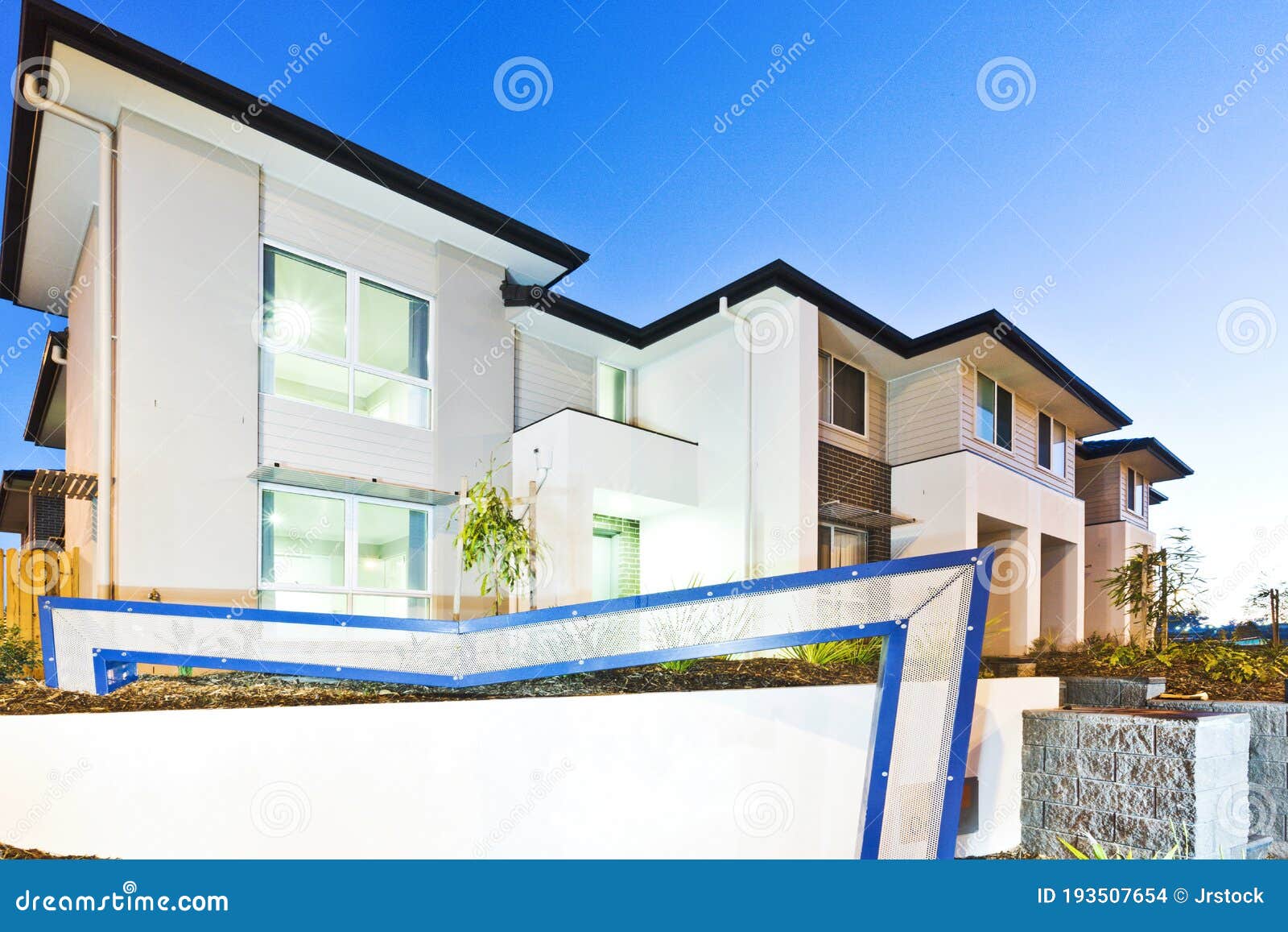 Modern House Exterior At Twilight. Luxury Villa With Garage. Stock Photo,  Picture and Royalty Free Image. Image 203466824.