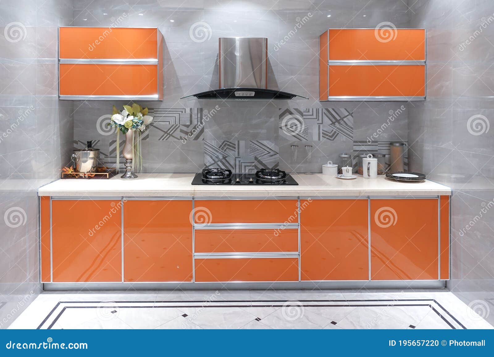 https://thumbs.dreamstime.com/z/modern-luxury-kitchen-orange-cabinets-kitchen%EF%BC%8Corange-cabinets%EF%BC%8Cstainless-steel-range-hood%EF%BC%8Cignition-stove%EF%BC%8Cstone-tile-floor-195657220.jpg