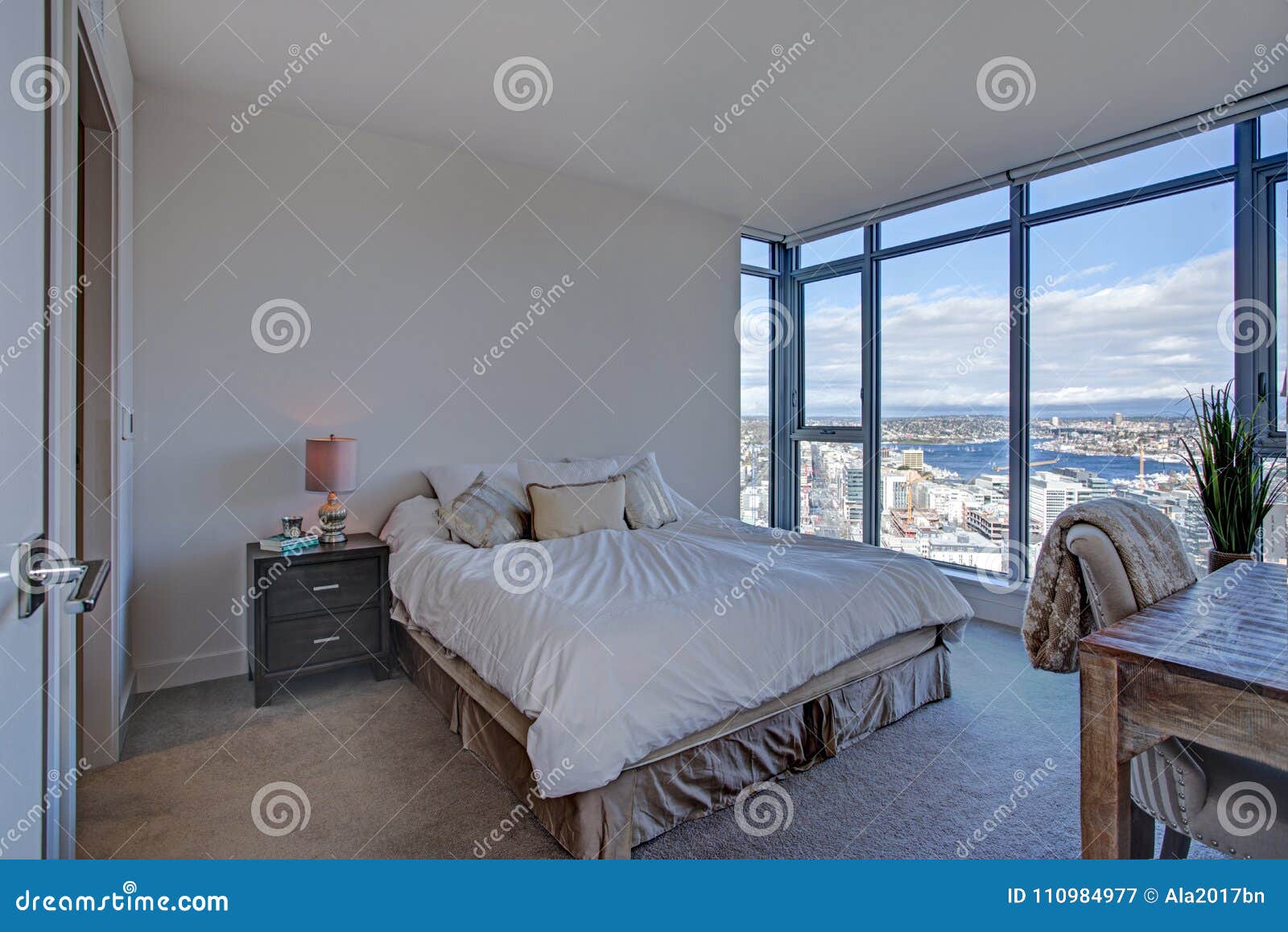 Modern Master Suite With Floor To Ceiling Windows Stock