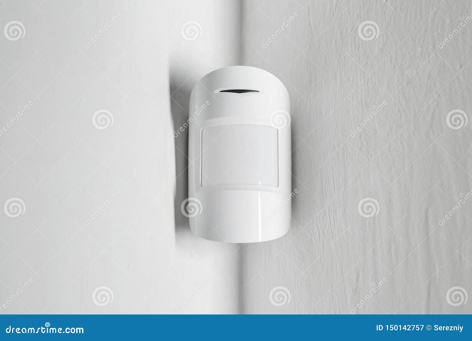 modern motion sensor on wall indoors