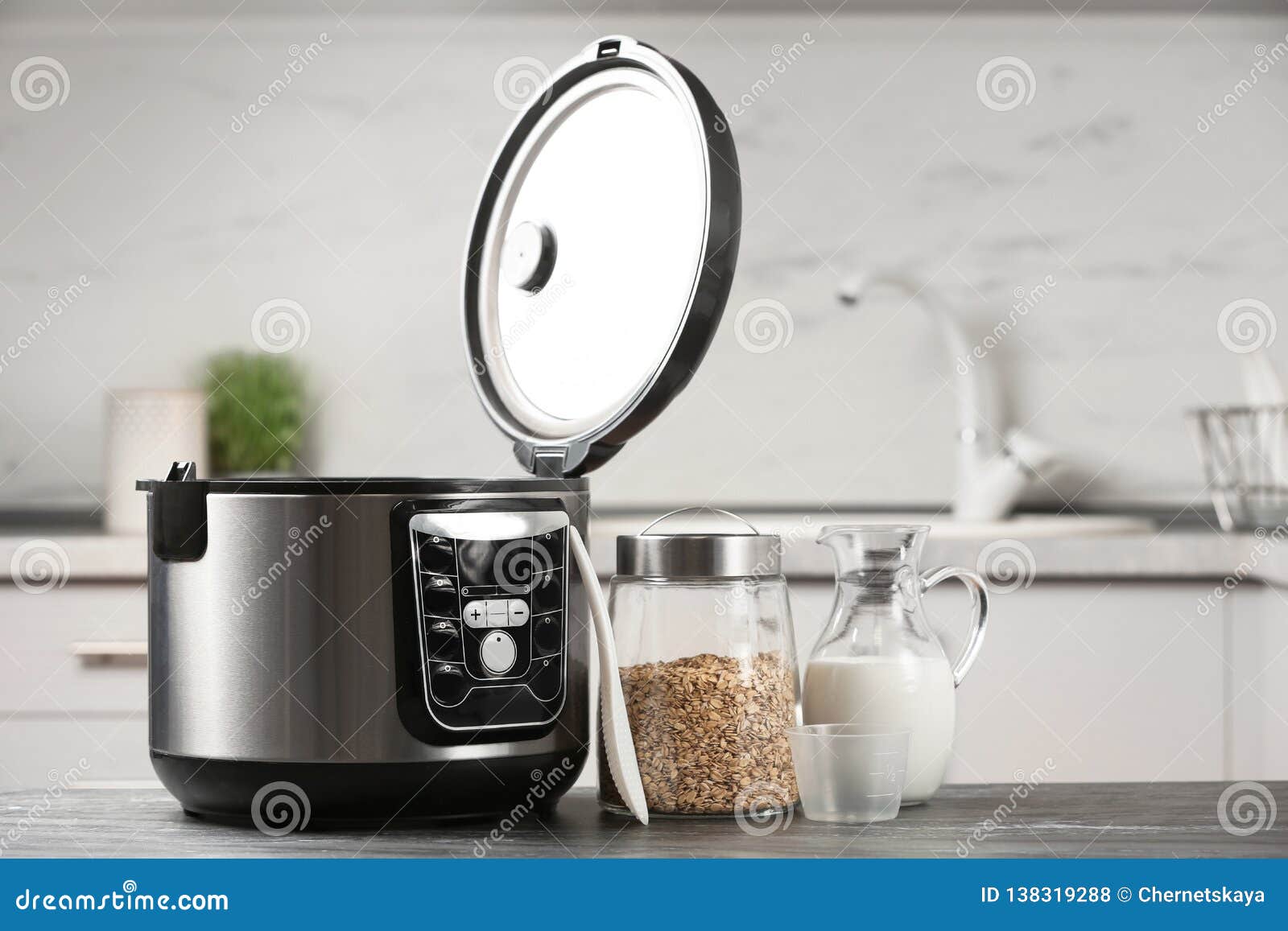 Modern Multi Cooker, Oatmeal and Milk on Table in Kitchen. Stock Photo Image of crockpot