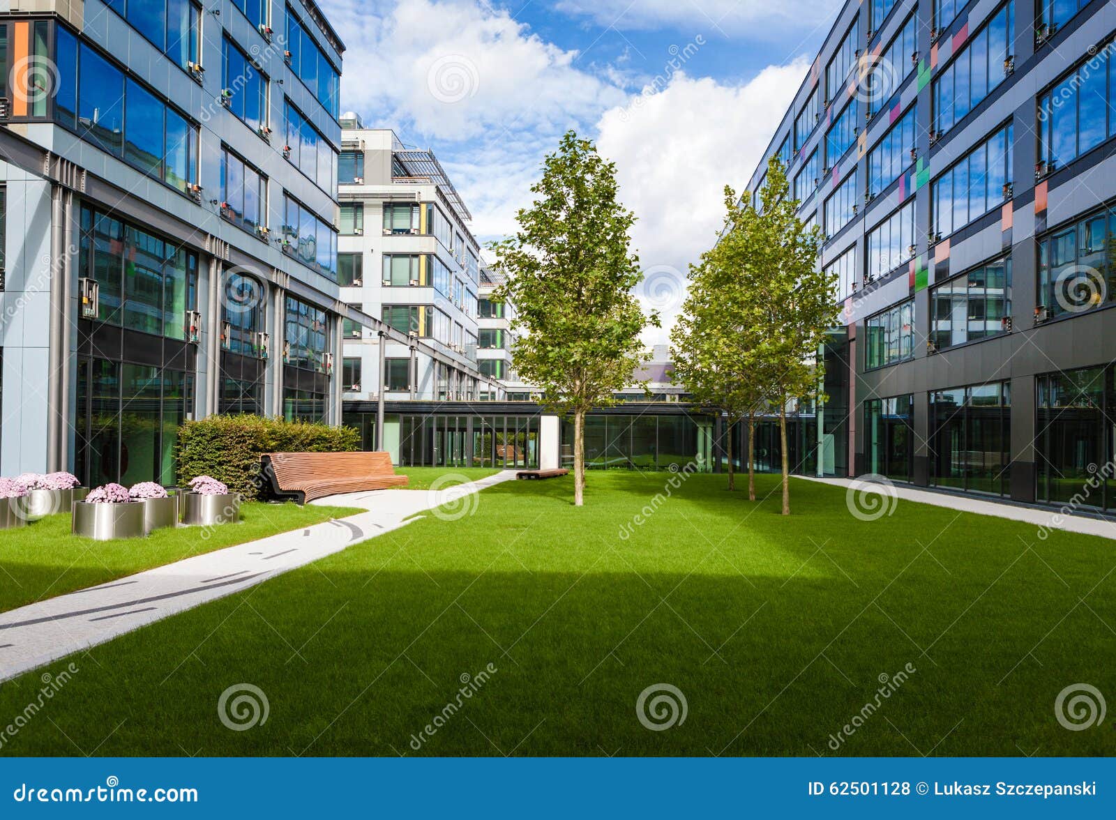 Modern Office Park with Green Lawn, Trees and Bench Stock Photo Image